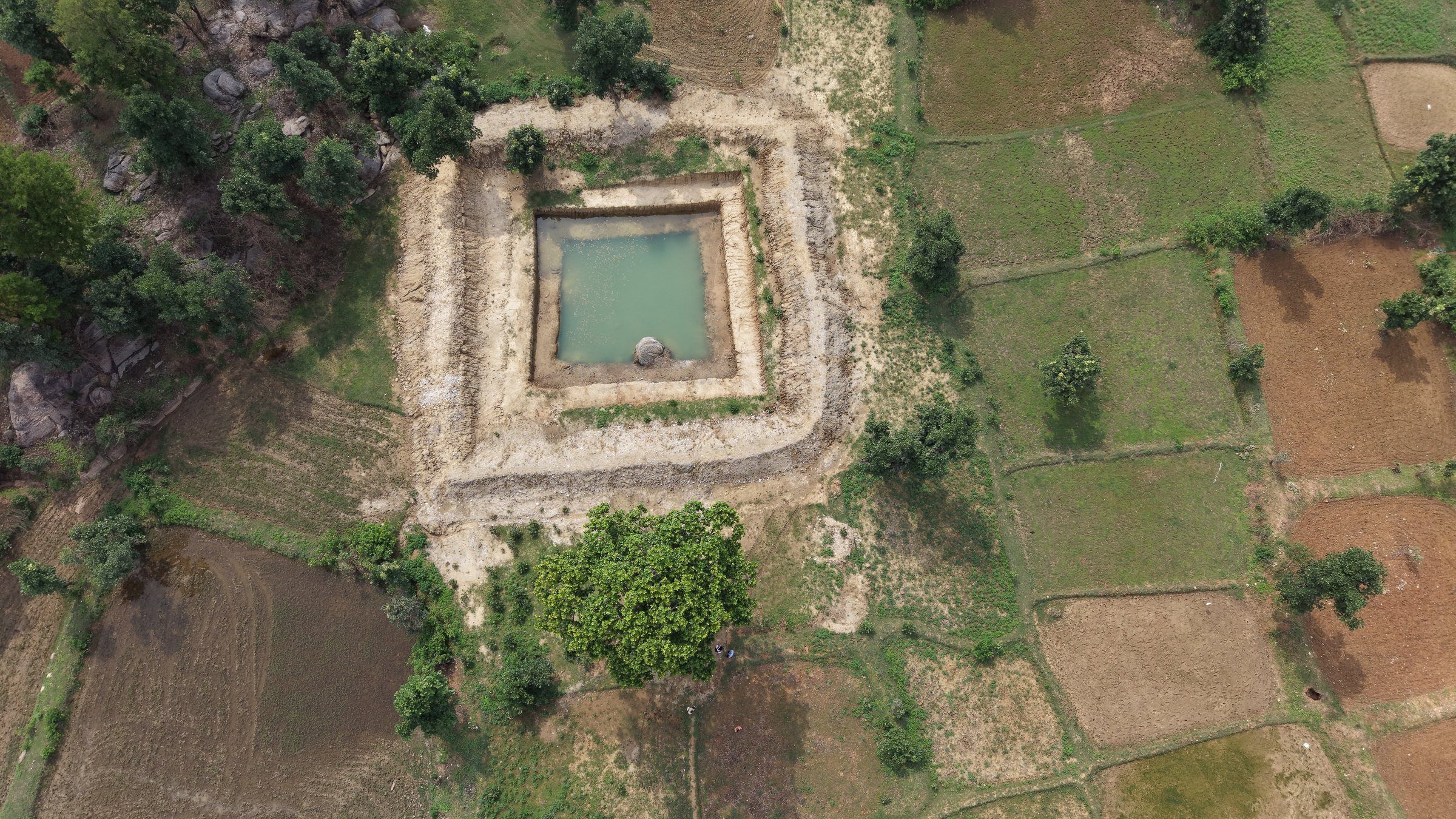 Aerial view of a farm pond among fields
